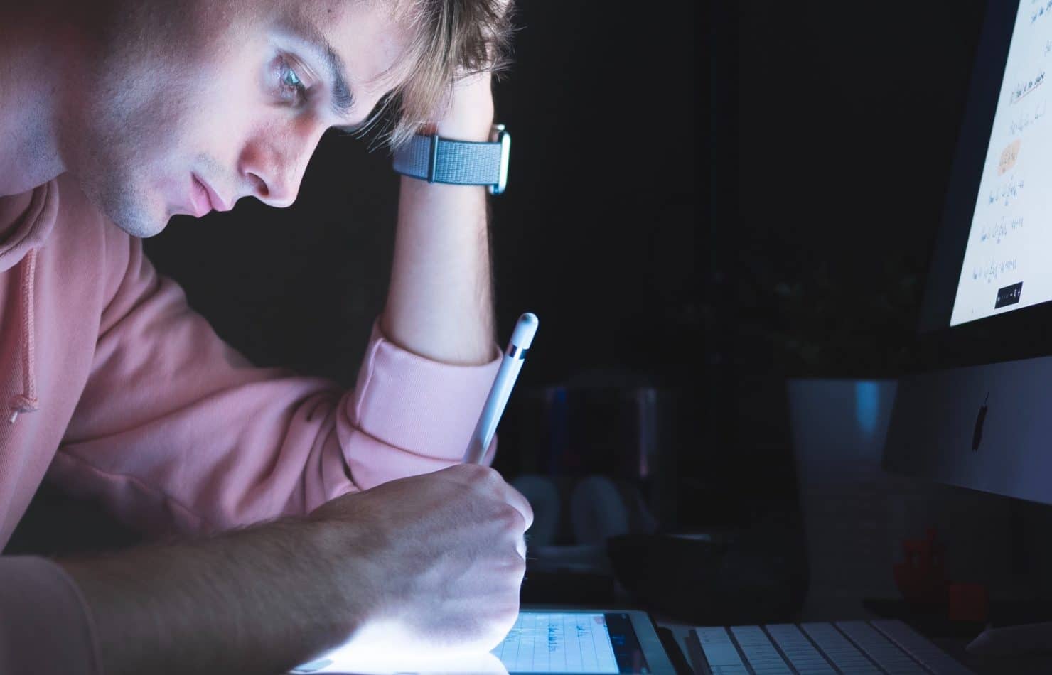 Man doing add and subtract on iPad
